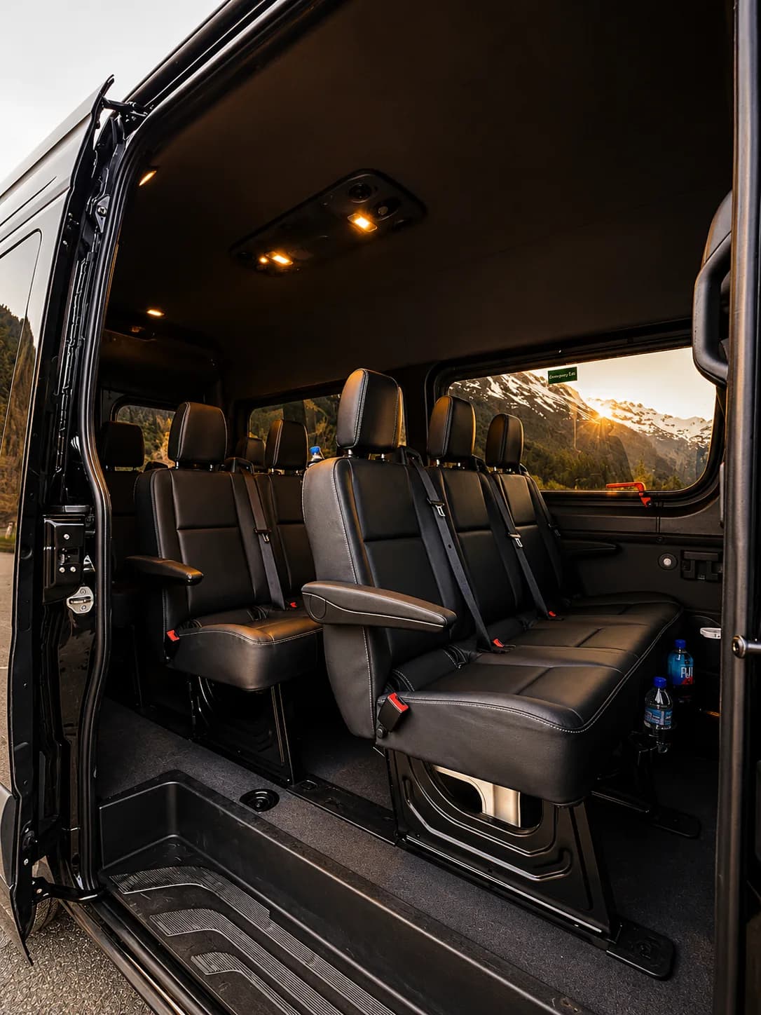 Interior of the Mercedes-Benz Sprinter Van through the open side door at sunset, premium leather seating